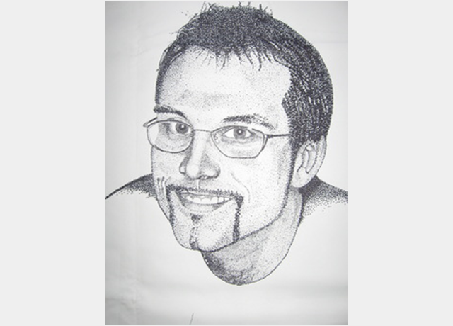 A drawing of a man with glasses and beard.